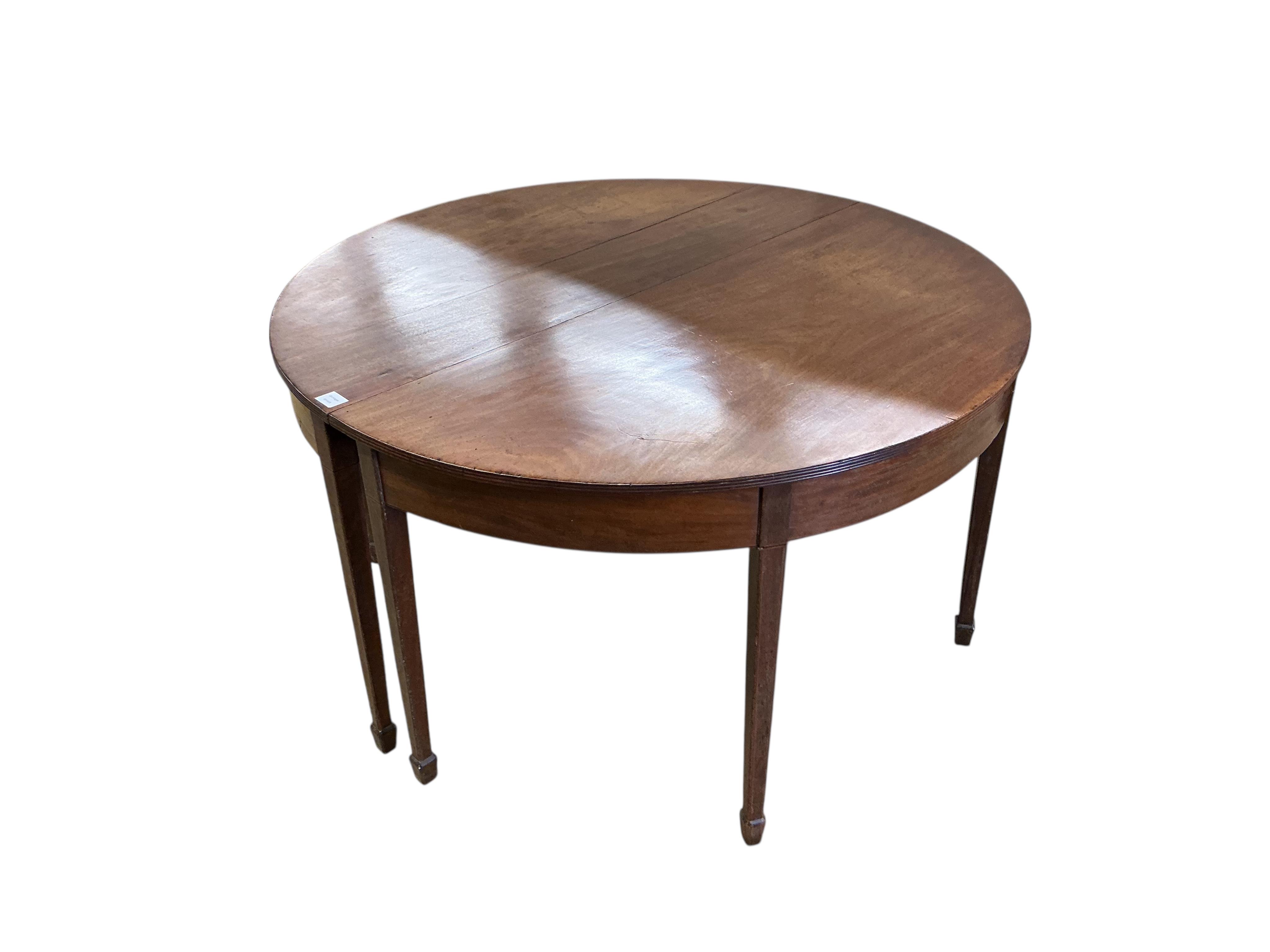 A George III mahogany D end extending dining table, width 180cm extended, one spare leaf, depth 132cm, height 72cm